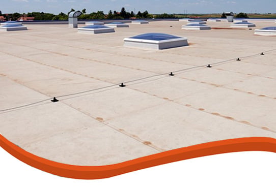 Flat roof with sky lights.