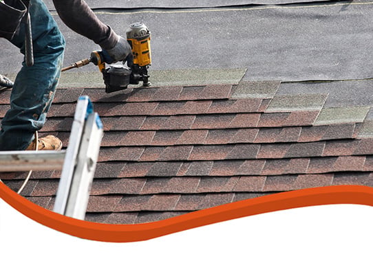 Shingles being installed on roof by stout roofing