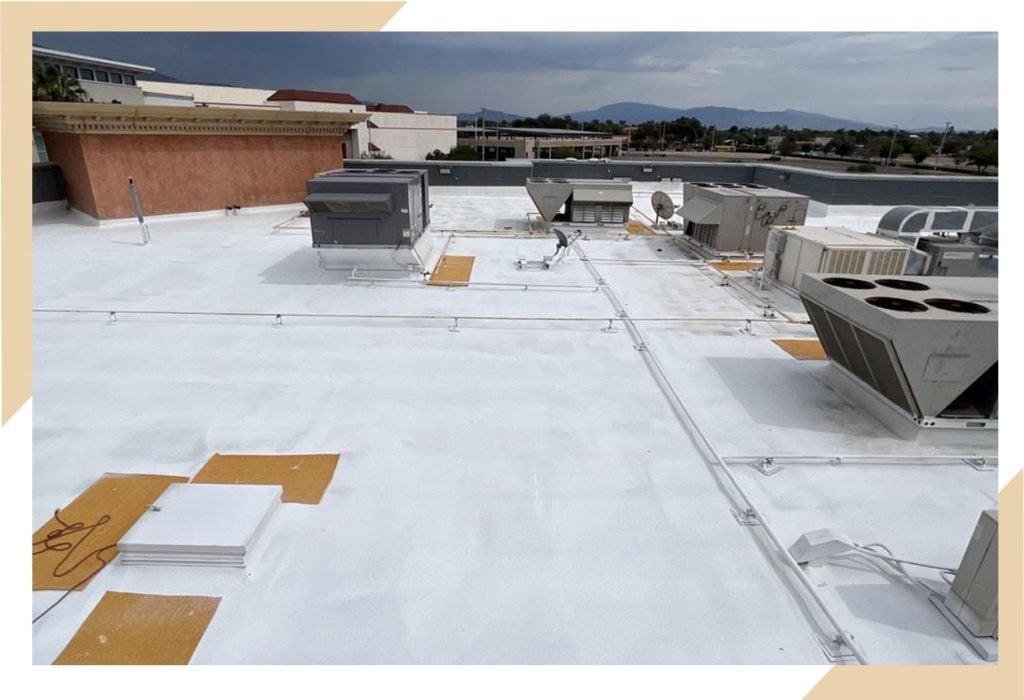 Commercial spray foam roof coating by stout roofing.