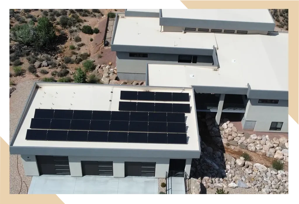 Flat roof home in arizona with solar panels installed by stout roofing.