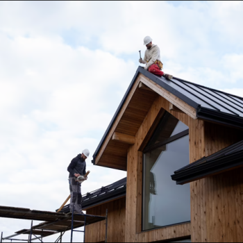Stout roofing installing metal roofing.