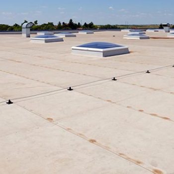 Flat commercial roofing with sky lights project by stout roofing.
